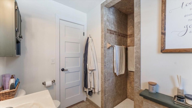 bathroom with a tile shower