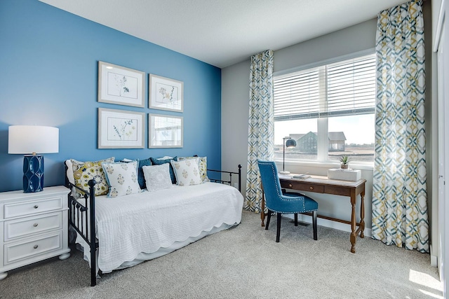 bedroom with light colored carpet