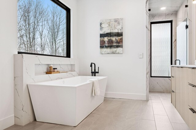 laundry room featuring baseboards