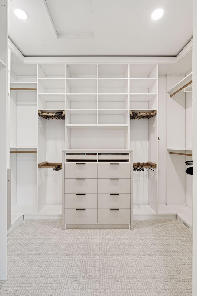 spacious closet featuring carpet flooring and visible vents