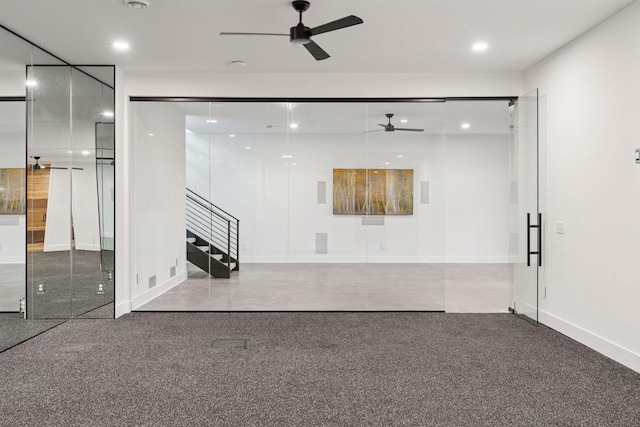 unfurnished room featuring ceiling fan, stairs, baseboards, and recessed lighting