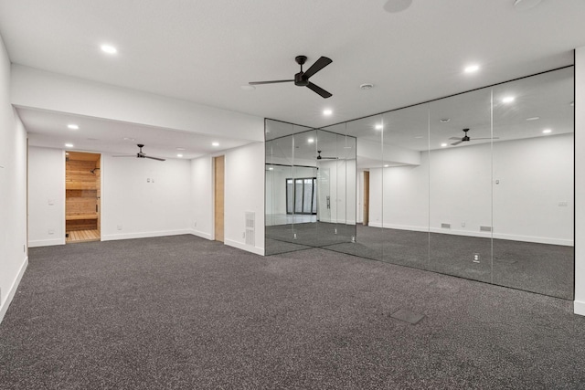 unfurnished room with baseboards, dark carpet, a ceiling fan, and recessed lighting