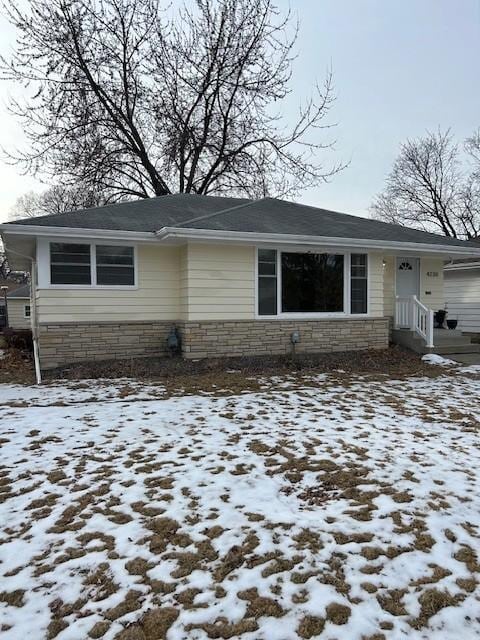 view of front of home with stone siding