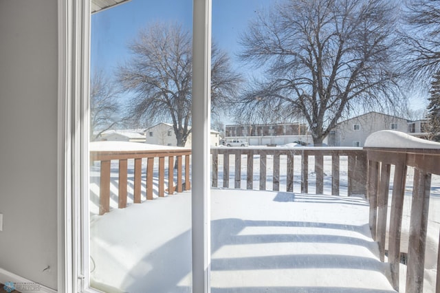 view of snow covered deck