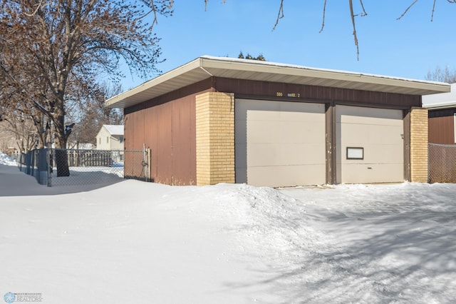 view of snow covered garage