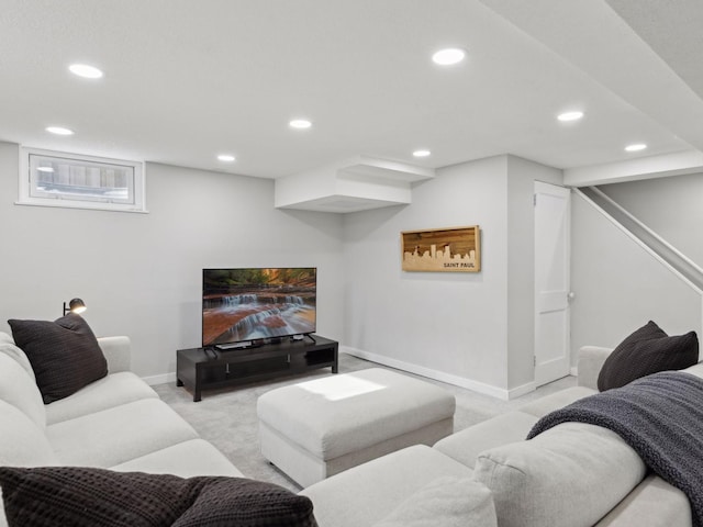 living room with light colored carpet, recessed lighting, and baseboards