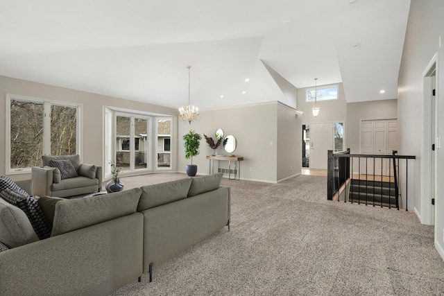 carpeted living area featuring a chandelier, recessed lighting, high vaulted ceiling, and baseboards