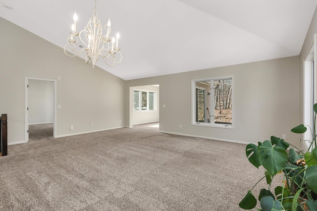 unfurnished living room featuring a chandelier, baseboards, carpet floors, and high vaulted ceiling