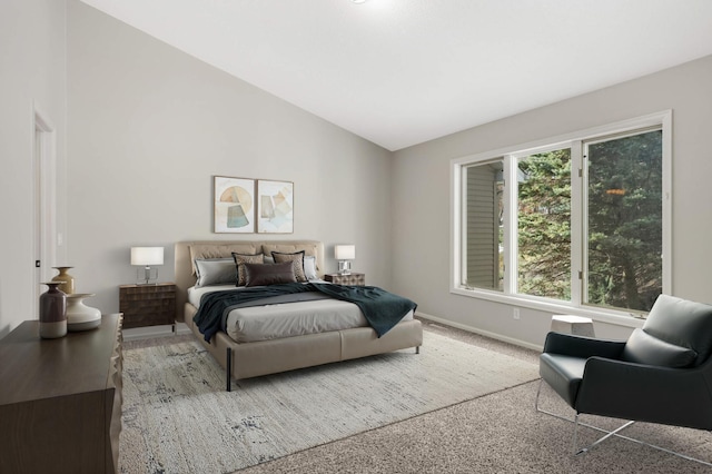 bedroom with baseboards, carpet flooring, and vaulted ceiling