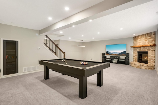 game room with visible vents, a brick fireplace, baseboards, light colored carpet, and recessed lighting