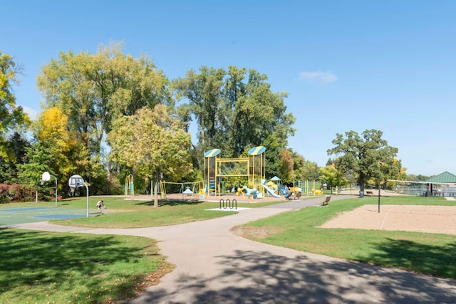 community play area with a yard, community basketball court, and volleyball court