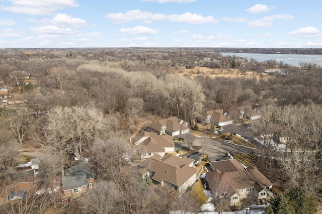 drone / aerial view featuring a residential view and a water view