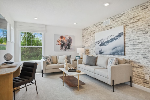 living room featuring light colored carpet and brick wall