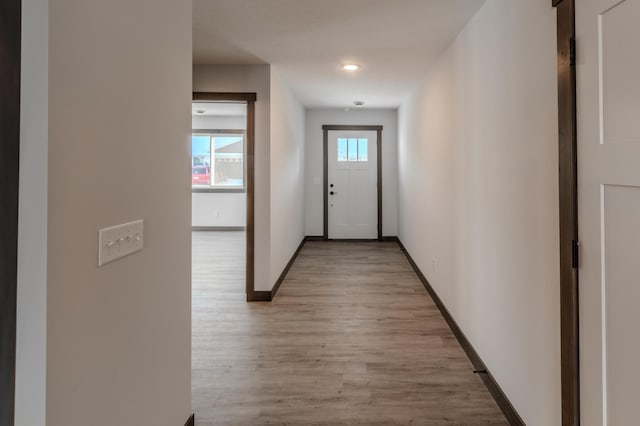 doorway with light wood-type flooring