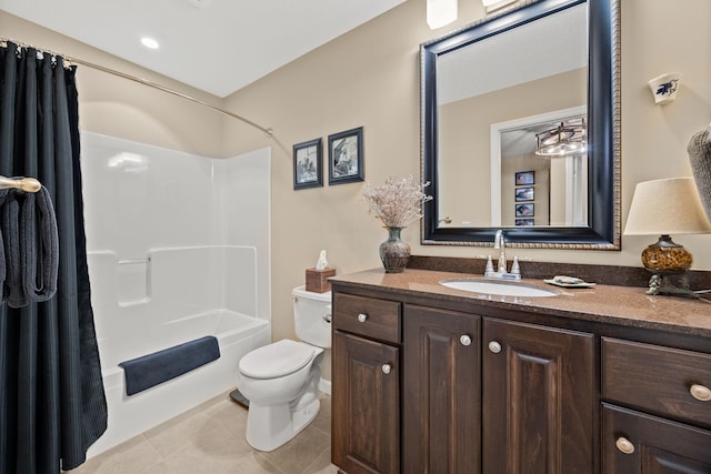 bathroom featuring vanity, tile patterned floors, toilet, and bathtub / shower combination