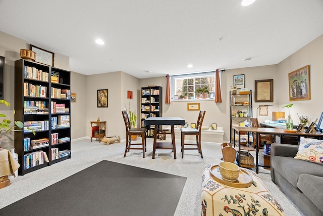 living area featuring recessed lighting, baseboards, and carpet