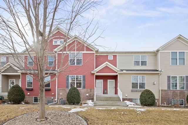 townhome / multi-family property with entry steps and cooling unit