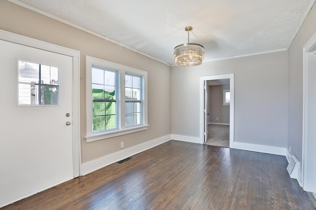 interior space with visible vents, baseboards, dark wood-style floors, an inviting chandelier, and crown molding