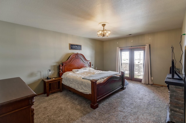 carpeted bedroom with a chandelier, access to outside, and a textured ceiling