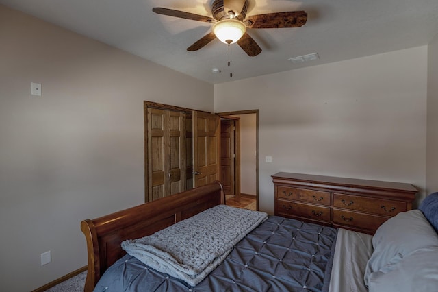 bedroom featuring ceiling fan and dark colored carpet