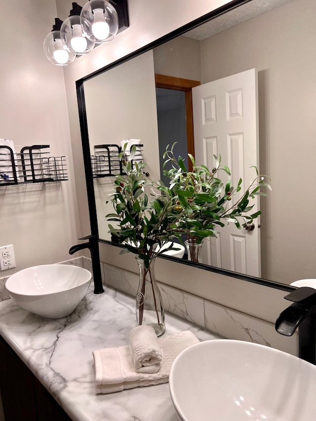 bathroom with sink and a textured ceiling