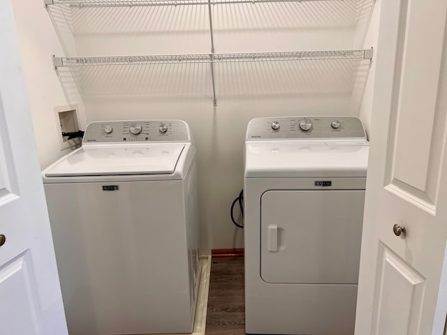 washroom featuring independent washer and dryer and wood-type flooring