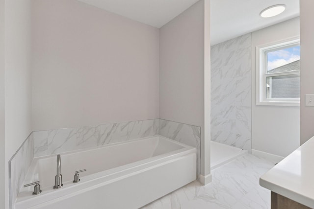 17953 Hidden Creek Trl, Lakeville, MN 55044 - bathroom with marble look tile flooring, a garden tub, vanity, and walk in shower
