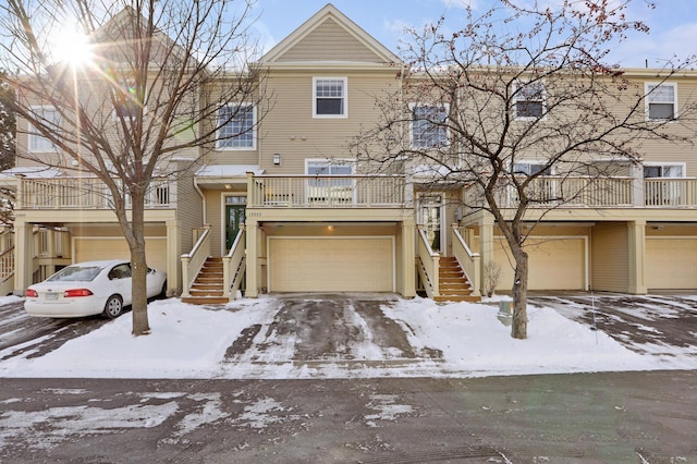 view of property featuring a balcony and a garage