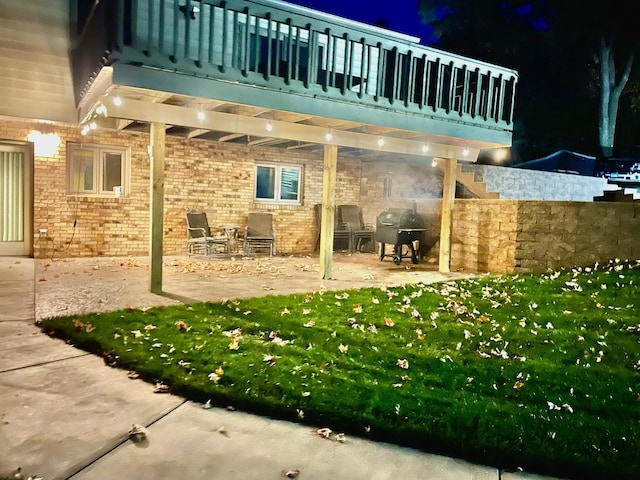 view of patio / terrace with grilling area and a balcony