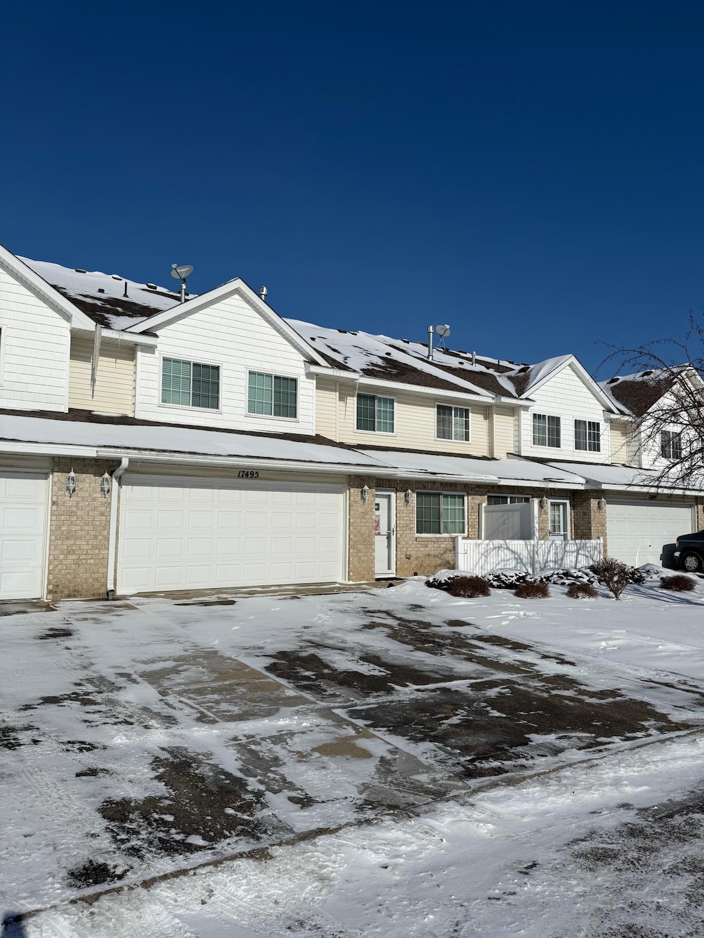 multi unit property featuring a garage