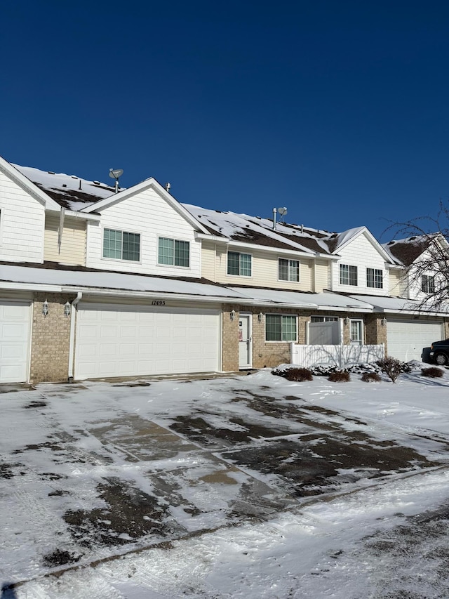 multi unit property featuring a garage