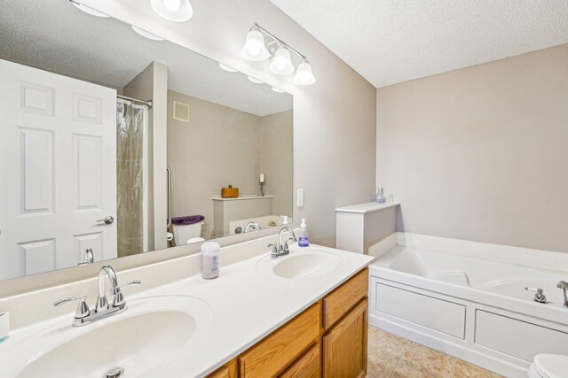 bathroom featuring tile patterned flooring, visible vents, a sink, and a textured ceiling