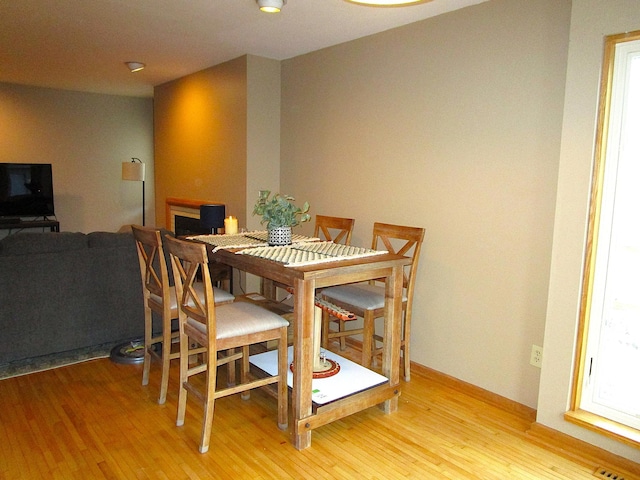 dining area with light wood finished floors