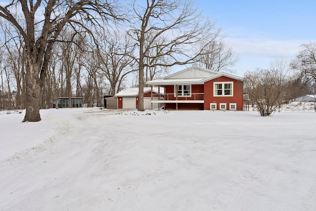 view of front of home with a garage and a porch