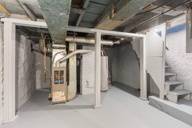 basement with water heater and heating unit