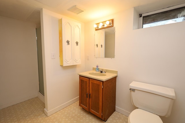 bathroom featuring tile patterned floors, visible vents, baseboards, and toilet