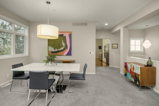 carpeted dining space with recessed lighting, baseboards, and visible vents