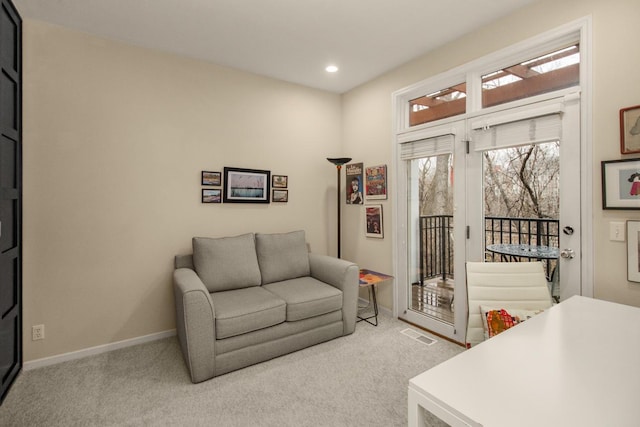 interior space featuring light carpet, visible vents, recessed lighting, and baseboards