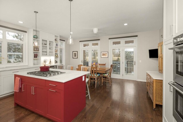 kitchen featuring open shelves, french doors, dark wood-style flooring, and appliances with stainless steel finishes