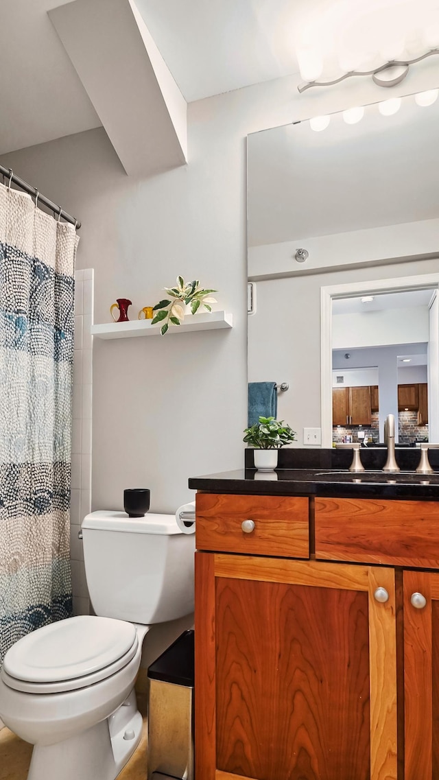 full bathroom featuring vanity and toilet