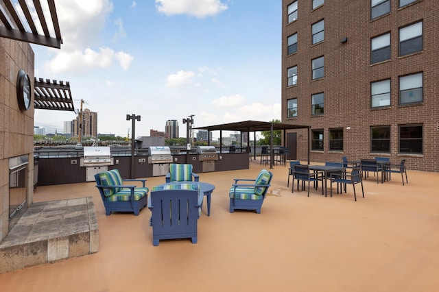 view of patio featuring a view of city, grilling area, area for grilling, and a pergola