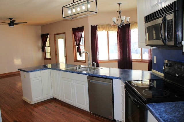 kitchen featuring sink, stainless steel dishwasher, white cabinets, and black range with electric cooktop