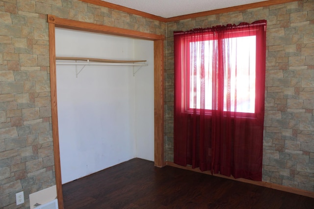 entryway with dark hardwood / wood-style flooring and a wealth of natural light