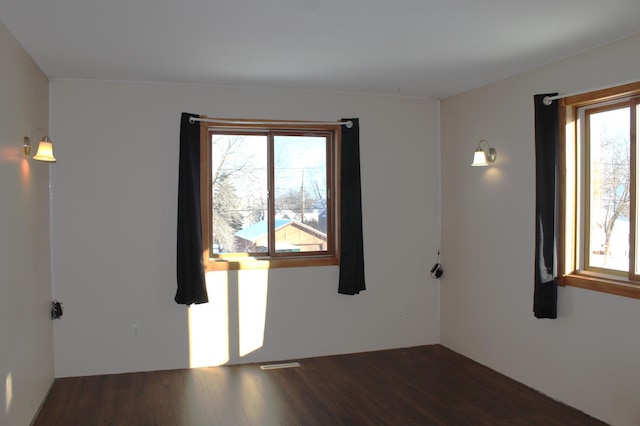 empty room featuring dark hardwood / wood-style floors