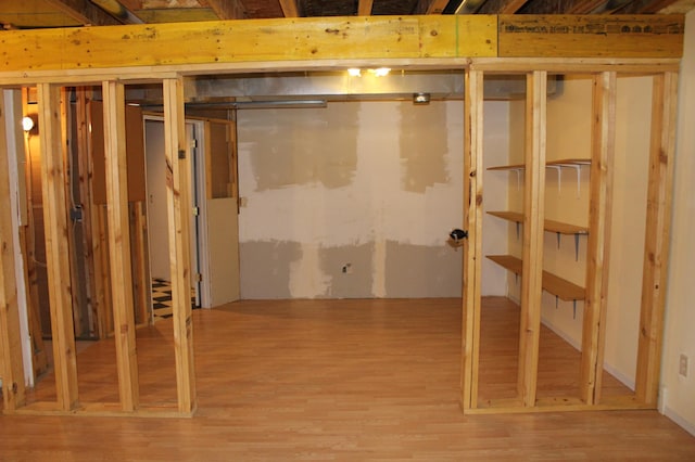 basement featuring hardwood / wood-style flooring