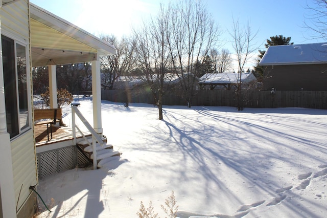 view of yard layered in snow