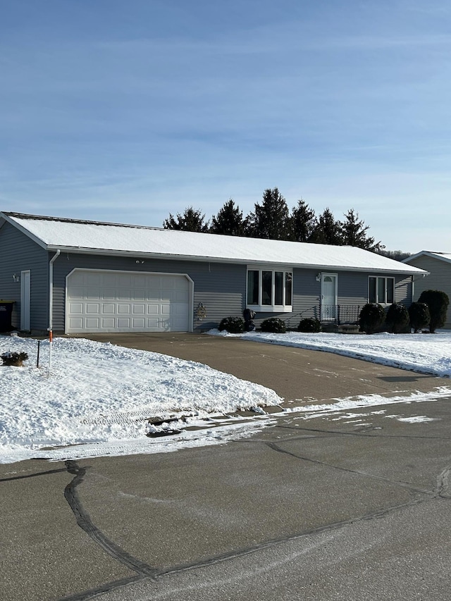 ranch-style house featuring a garage