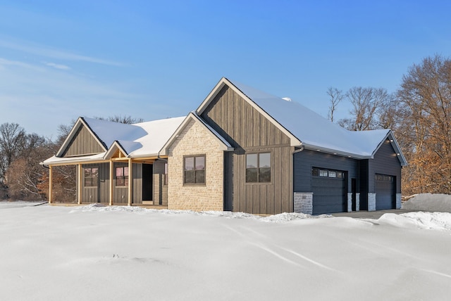 view of front of home with a garage and covered porch