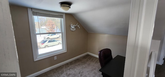 bonus room with vaulted ceiling and carpet