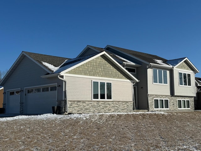 craftsman-style house featuring a garage